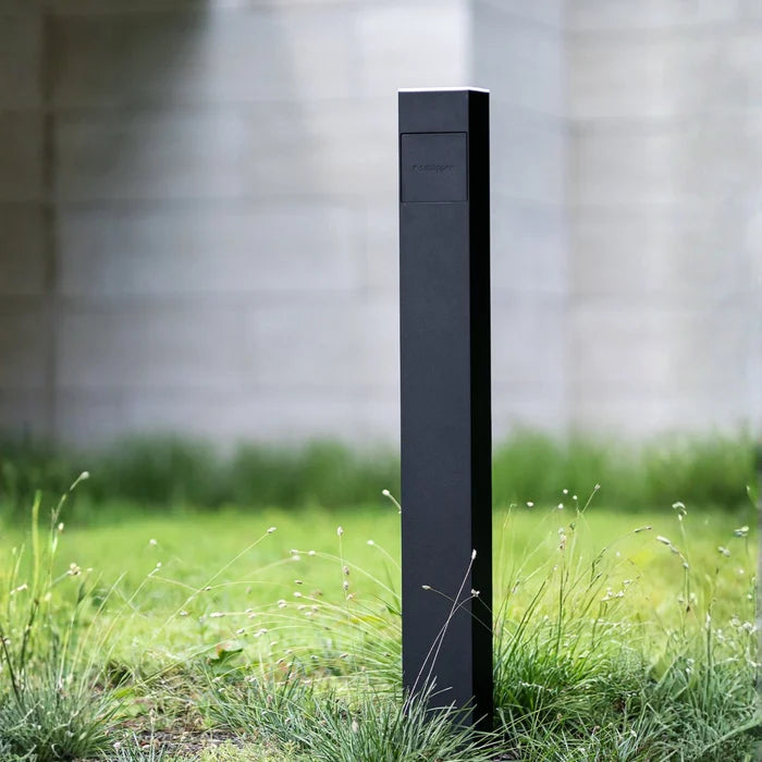 Smappee EV One black bollard EV charger standing in garden - buy 22kW ground mount Type 2 charger