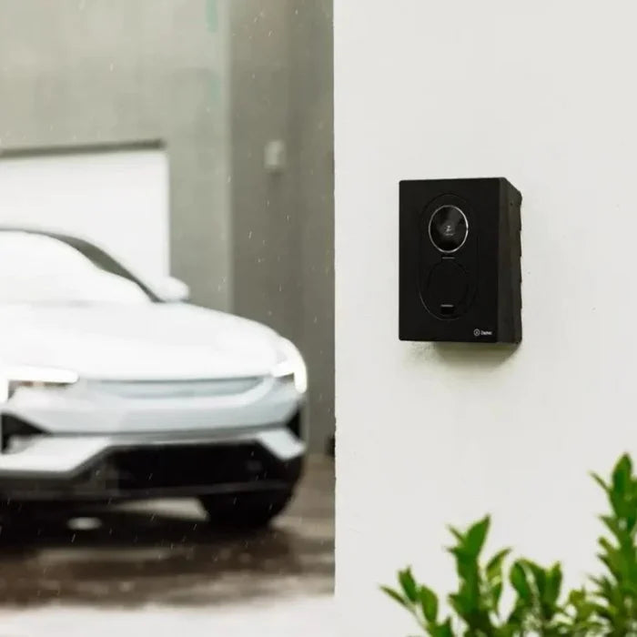 Zaptec Go 2 22kW 3-phase 32A Type 2 socket EV charger installed on wall with car charging in driveway - buy home charging point
